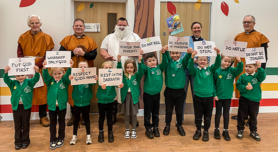 Children and adults taking part in an Open the Book Bible story activity